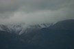 Snow on the cloudy mountains at Kaikoura