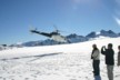 Another helicopter takes off from the glacier