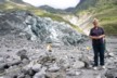 The alpine guide in casual dress at the end of the walk to the Fox glacier