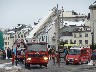 Fire engines giving visitor lifts up in the ladder compartment