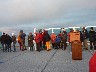 Passengers gather to watch the ceremony