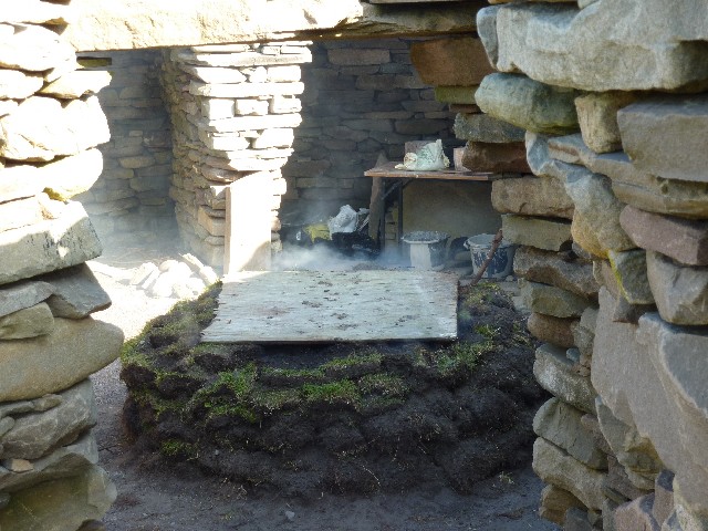 Peat burning in Broch