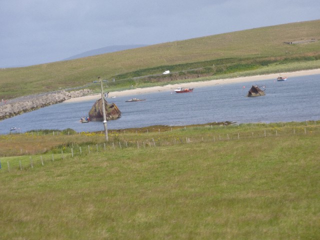 Sunken boats outside barriers in Scapa Flow