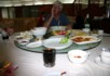 Removing a mote from the eye whilst at lunch in Kunming
