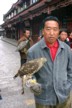 Lijiang men with hawks for hunting