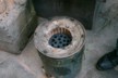 Heating device for cooking using a block of coal dust