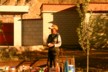 Little boy selling goods from a cart