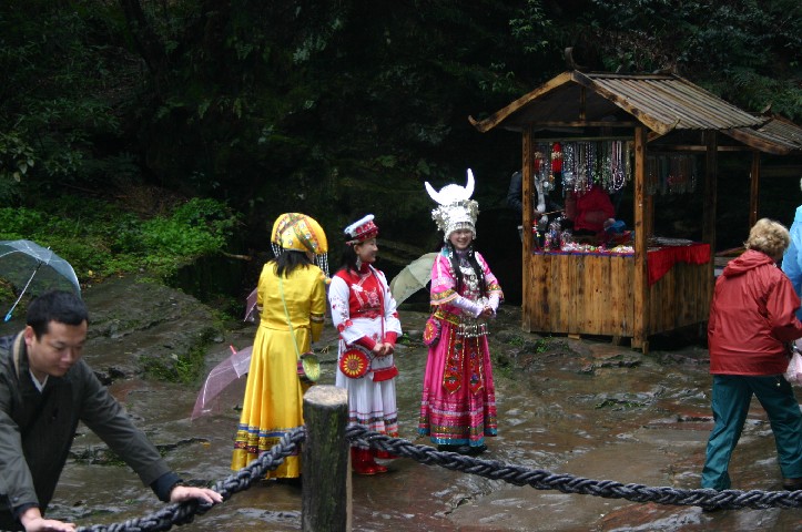 Miao girls hoping for money for pictures taken with you and them