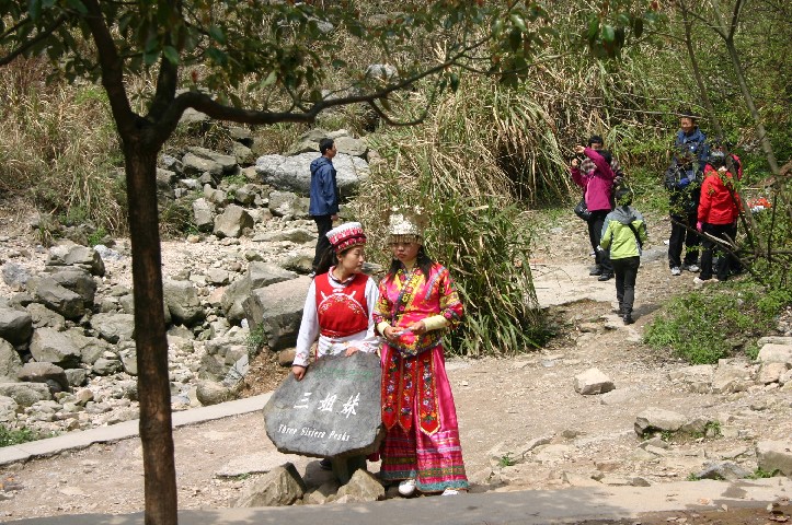 Miao girls waiting for money for photos