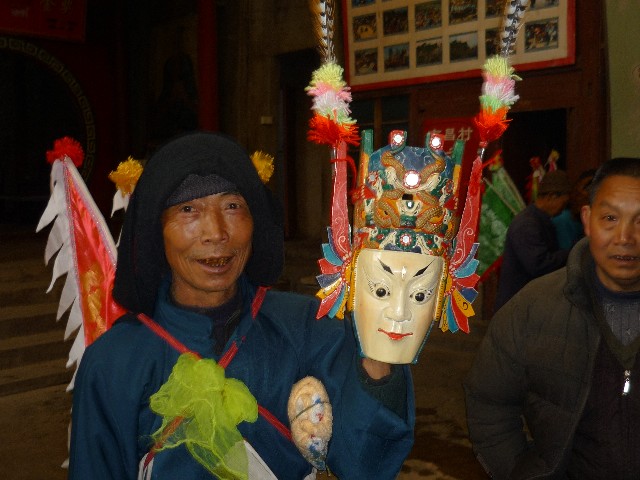 Proud dancer with his wooden mask