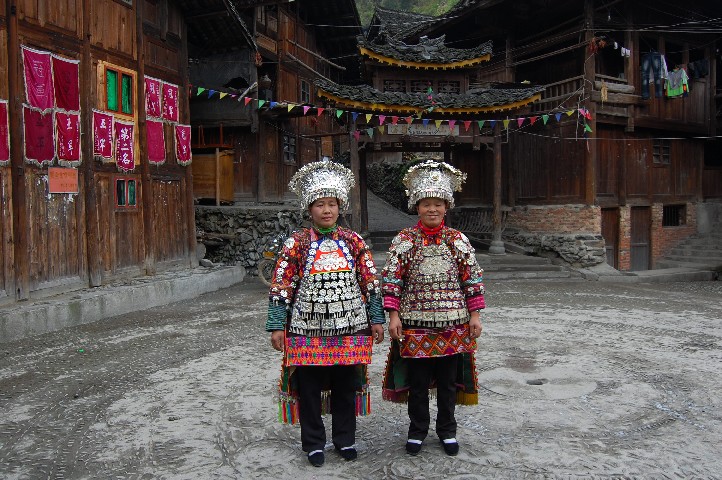 Higher up the short skirted Miao village