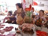 Buying the pork in the market