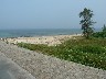 Beach by the port on right going to boat