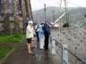 At the base of the statue in the rain
