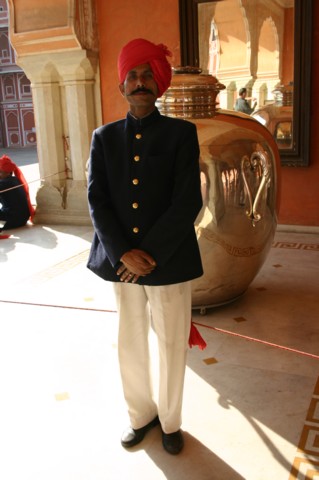 Guarding one of the large silver jars