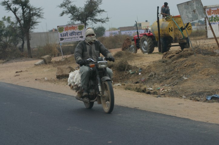 Man taking live chickens to market