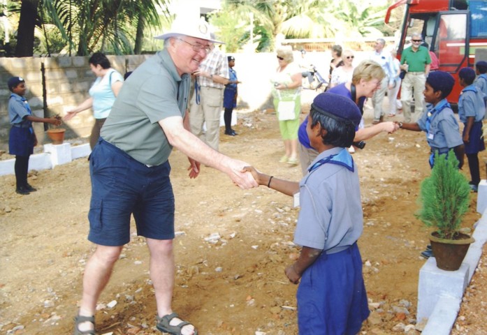 Graham says 'Namaste' to a greeter