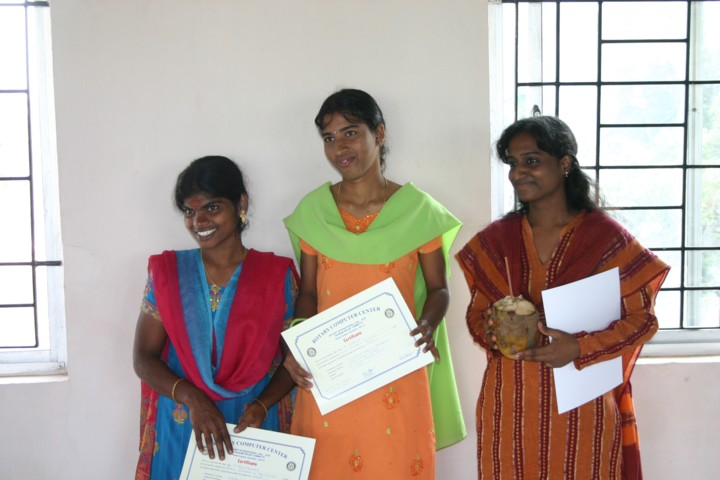 Three happy computer students