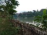 On Mekong at Luang Prabang view to bridge crossing river Nam Khan
