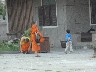 Monks playing with the children in the Wat