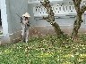 Bach Ma Temple gardener sweeping upthe leaves