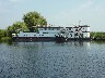 Our floating pontoon with its tug boat